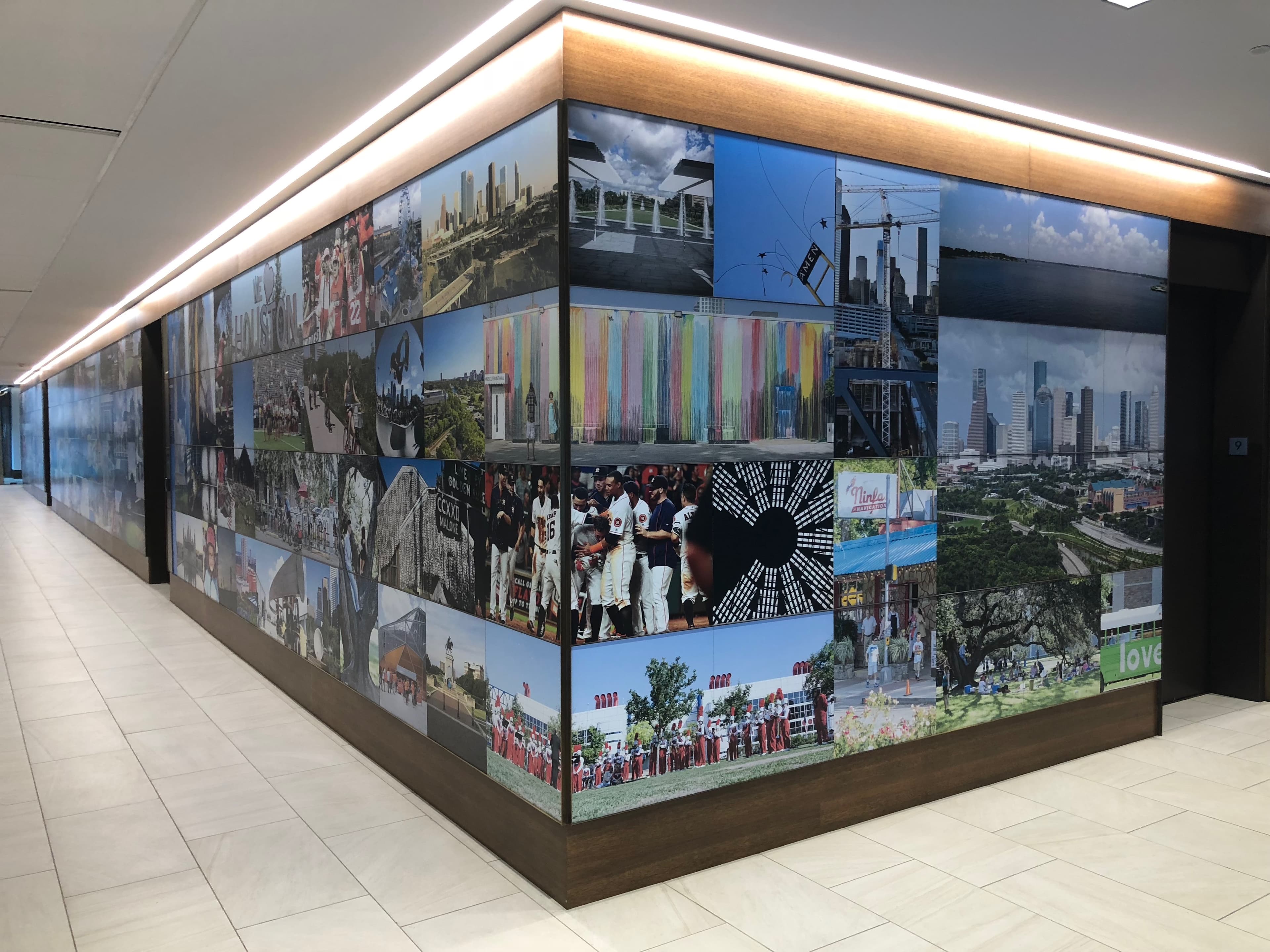 HouWall’s completed photographic installation wrapping an illuminated corner at the Greater Houston Partnership.